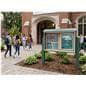 Outdoor bulletin board with posts being utilized on a college campus