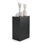 Retail display pedestal showcasing vases and home decor on top