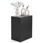 Retail display pedestal showcasing vases and home decor on top