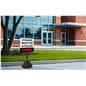 48" parking lot sign base shown with sign, posted outside of a school building