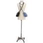 Mobile female sewing mannequin with decorative spring and foot pedal details 