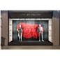 Female full body mannequin in storefront window with male mannequin