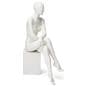 Abstract seated female mannequin with egg head design 